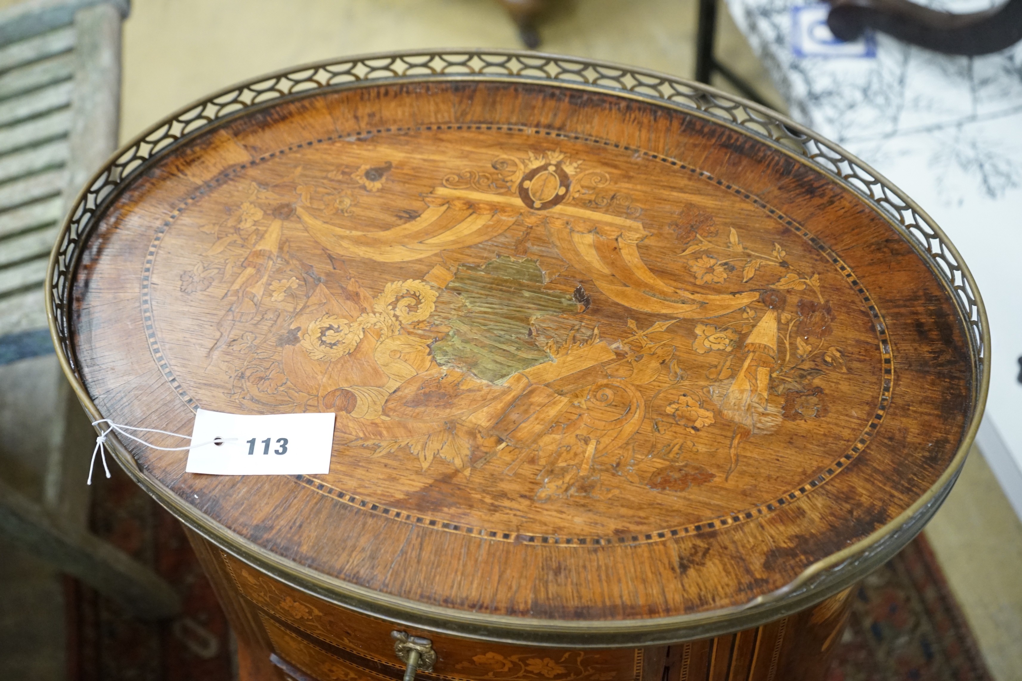 An early 20th century French marquetry oval three drawer small chest, width 50cm, depth 36cm, height 80cm